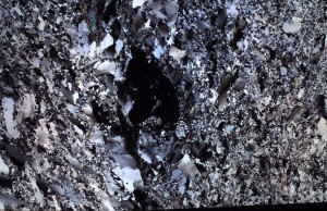 thin section crossed polarizers quartzite with shocked minerals